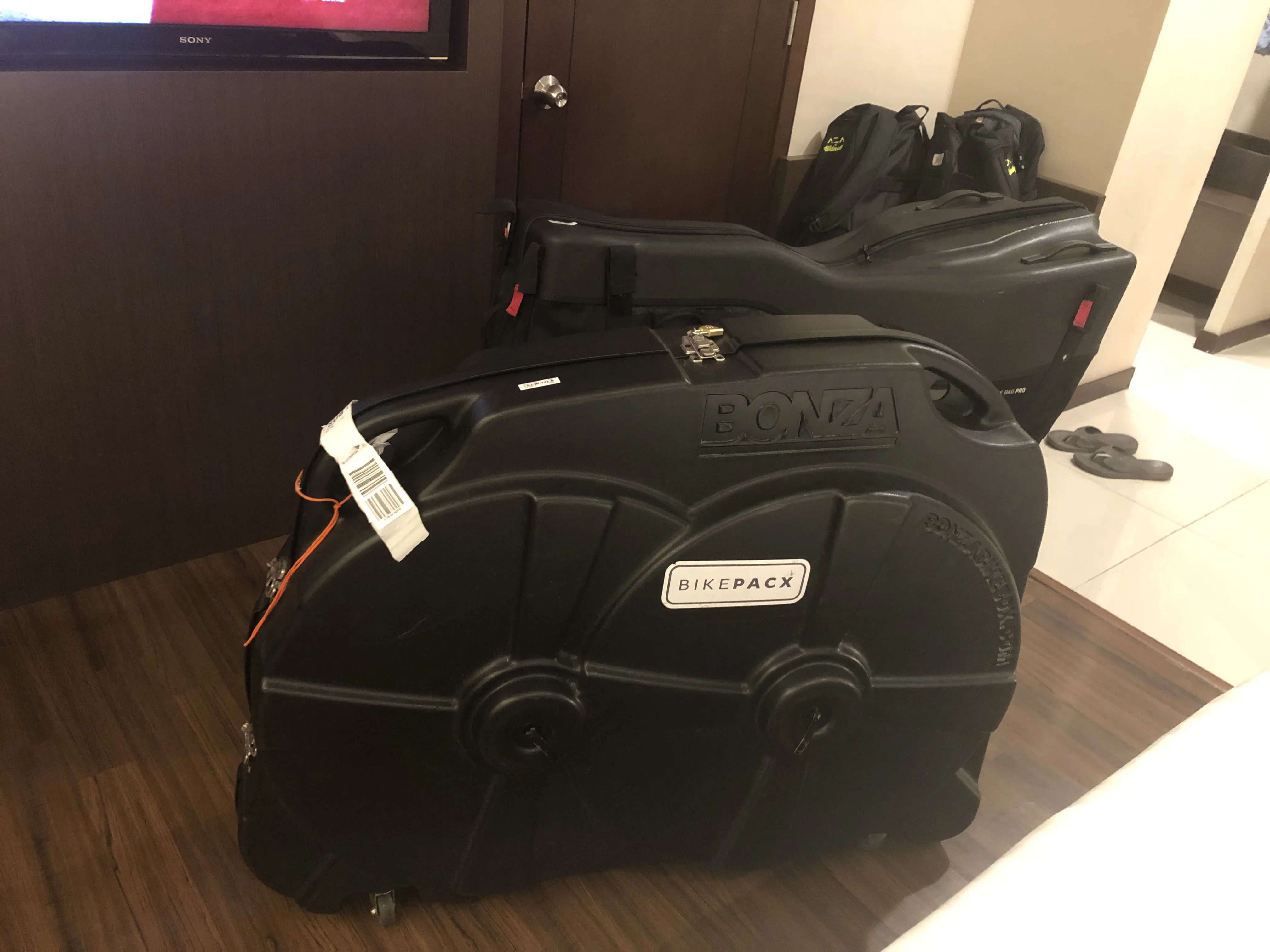 Mine and my friend's bike box. It's not very visible from the image, but my friend's one is longer and is an easy-fit one, so no need to release the bike handlebar.