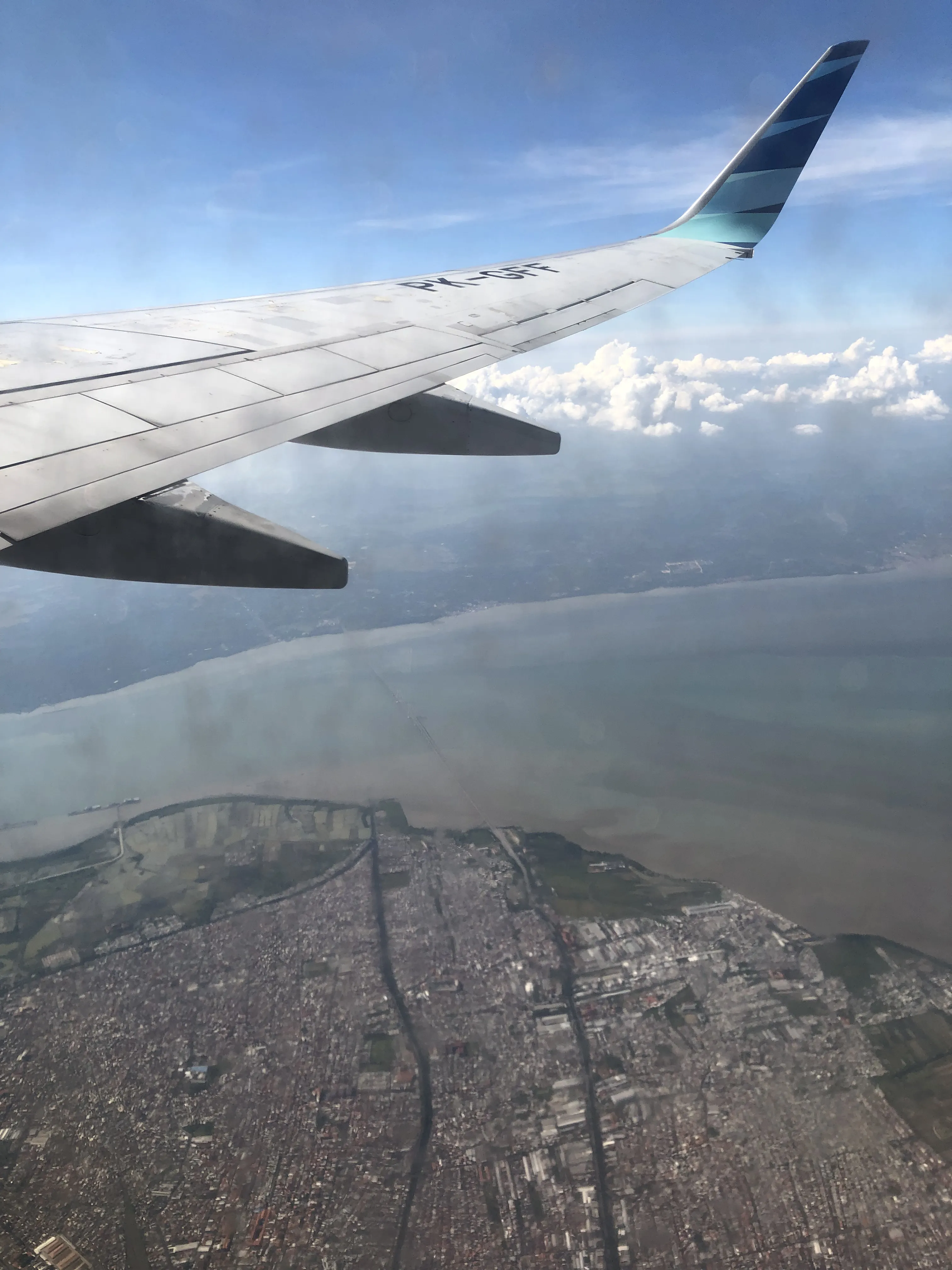 I can see Madura island and Suramadu bridge from the plane. (Yes the window is dirty, I can't wipe it from my side.)