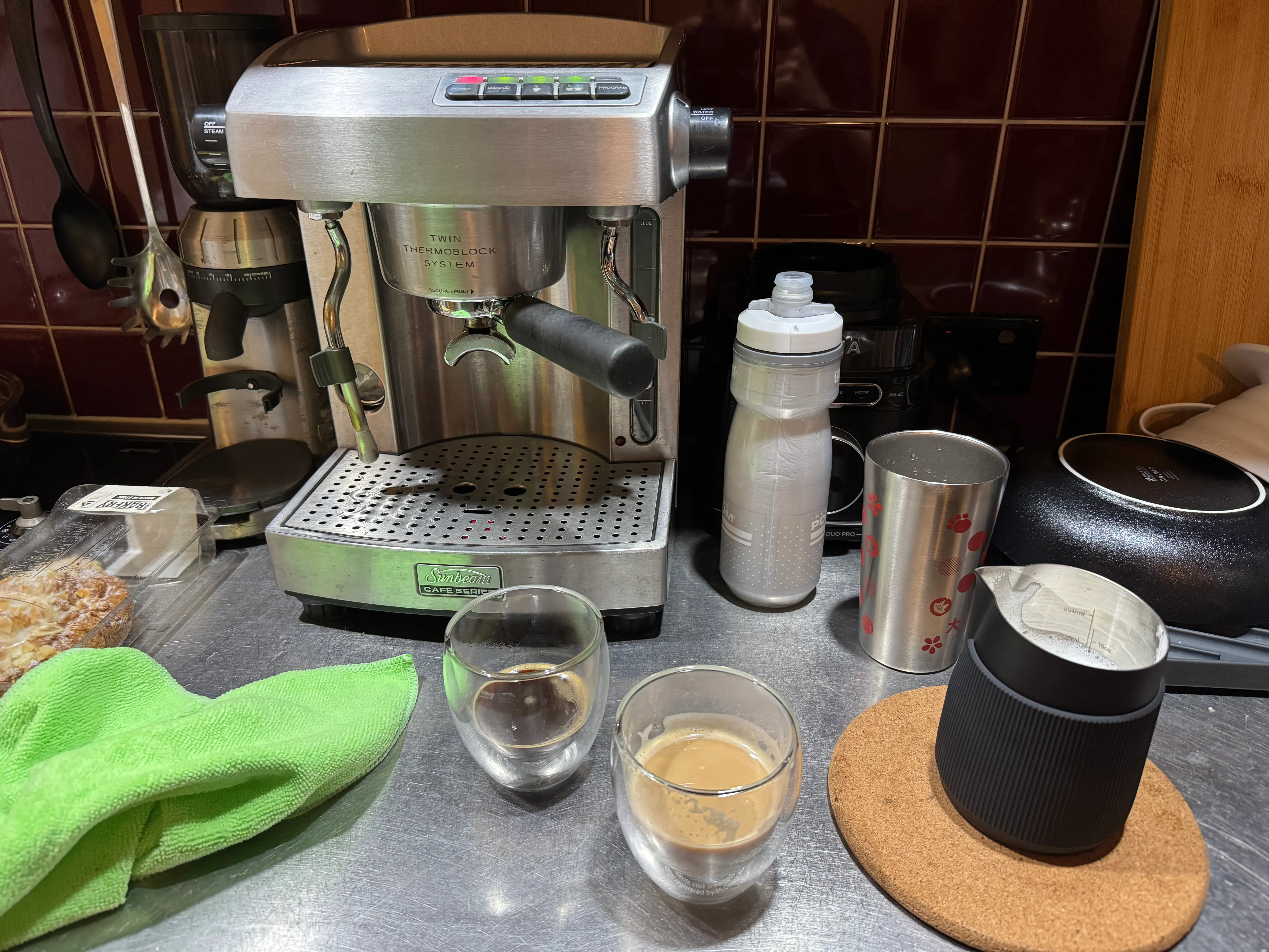 My first ever (successful?) espresso along with the Sunbeam espresso machine and grinder. Taken at 2025-10-10.